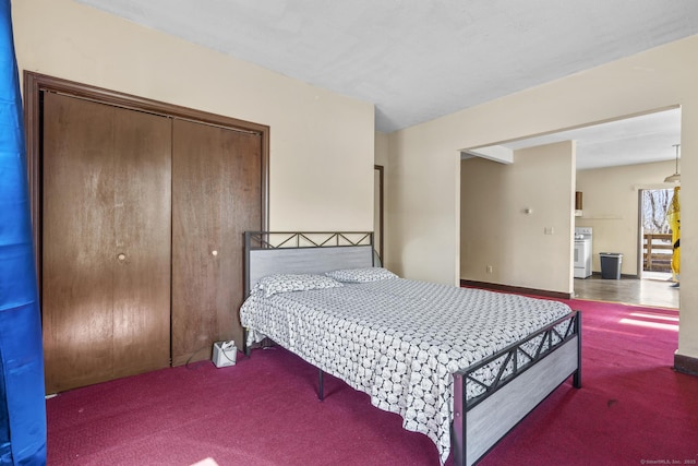 carpeted bedroom featuring a closet