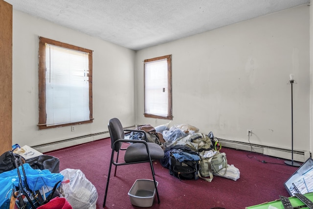 misc room with carpet, a textured ceiling, and baseboard heating