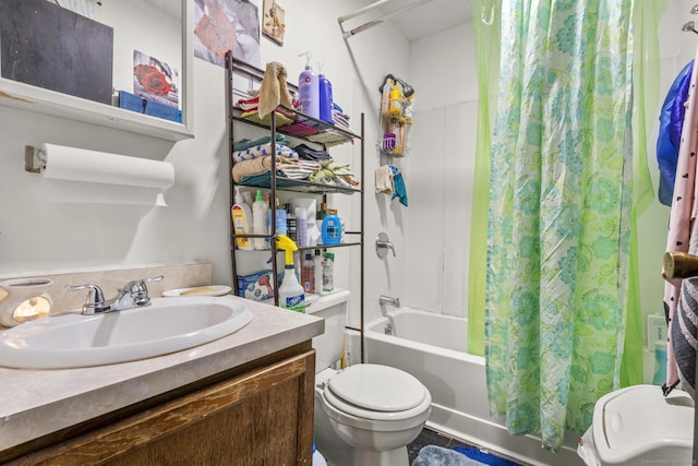 full bath featuring shower / bathtub combination with curtain, toilet, and vanity