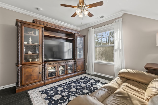 living area featuring baseboards, visible vents, ornamental molding, and wood finished floors