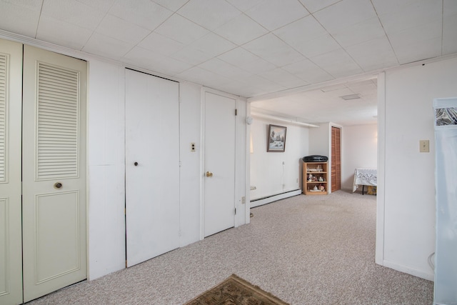 interior space with carpet floors and a baseboard radiator