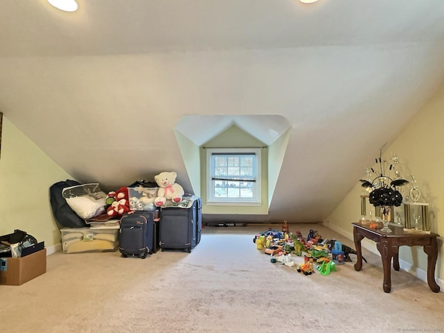 rec room with lofted ceiling, baseboards, and carpet flooring