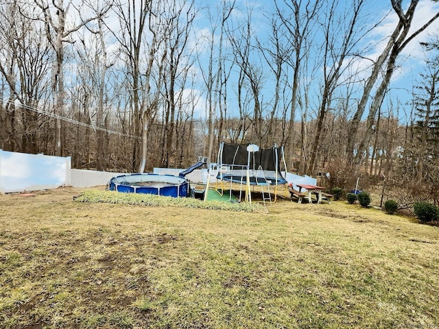 view of yard with a trampoline