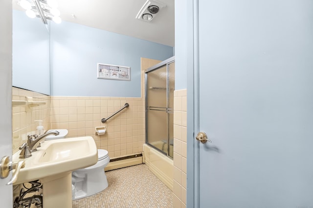 full bath with tile walls, visible vents, toilet, baseboard heating, and tile patterned floors