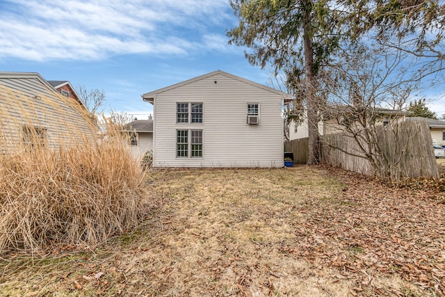 rear view of house with fence