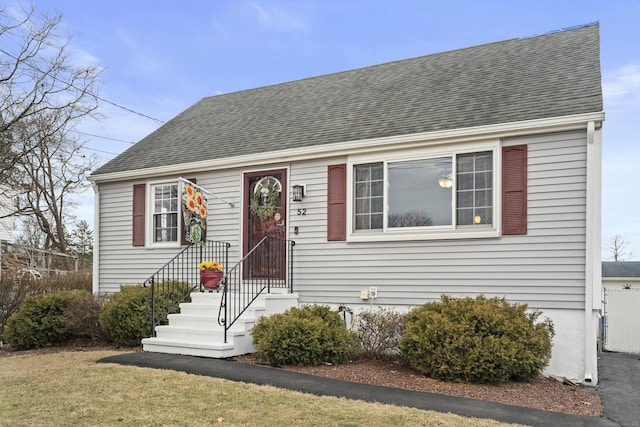 view of front of house with roof with shingles