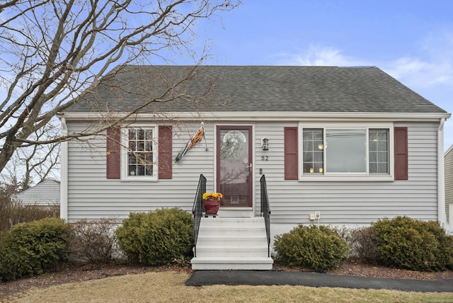 view of front of house with roof with shingles