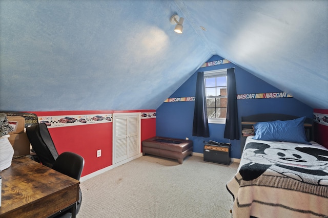 bedroom featuring baseboards, vaulted ceiling, and carpet flooring