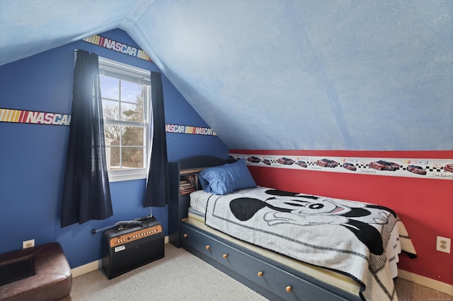 bedroom with carpet flooring, vaulted ceiling, and baseboards