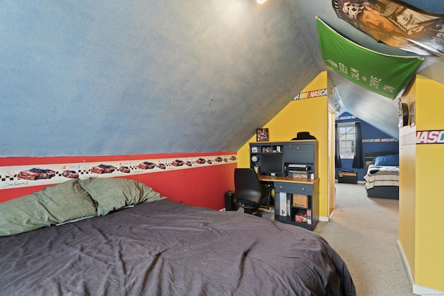 bedroom with lofted ceiling, carpet, and baseboards