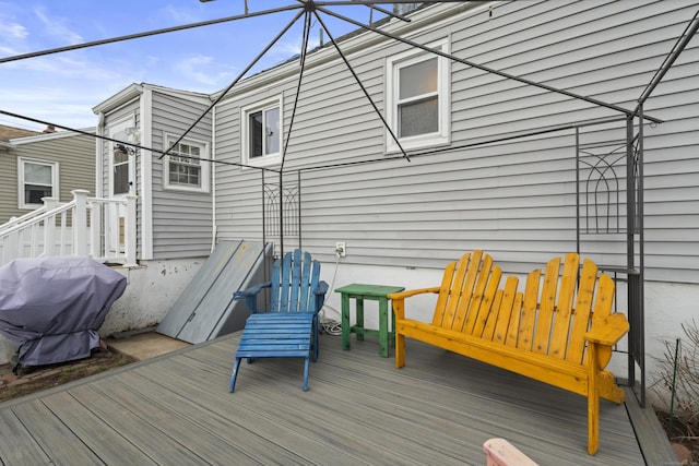 wooden terrace featuring grilling area