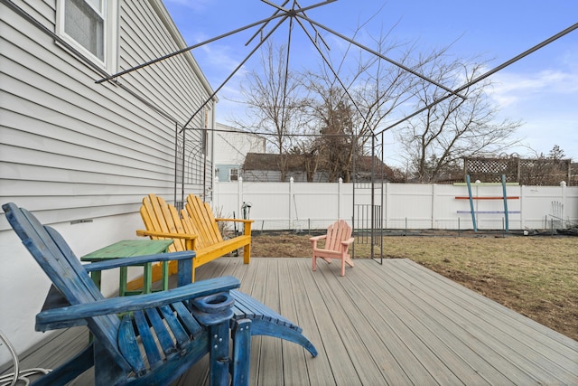 wooden deck featuring a fenced backyard