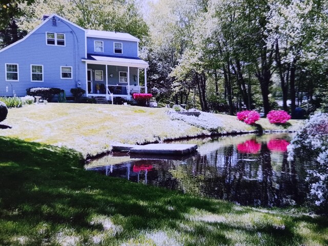 153 Bozrah St, Bozrah, CT 06334 - back of house with a porch and a lawn