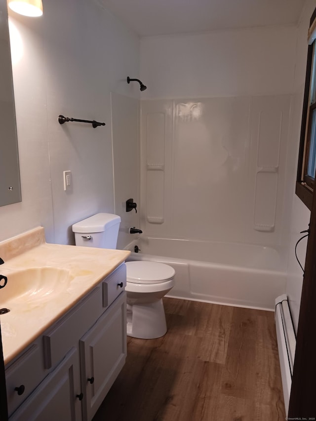 153 Bozrah St, Bozrah, CT 06334 - bathroom featuring a baseboard heating unit, wood finished floors, vanity, and shower / tub combination