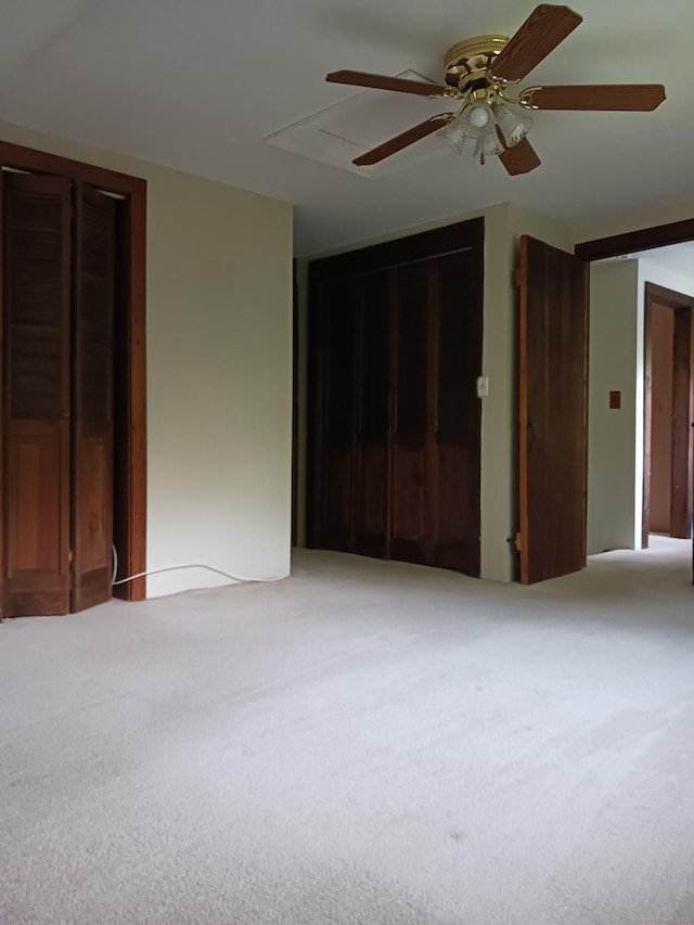 153 Bozrah St, Bozrah, CT 06334 - unfurnished bedroom with carpet floors, ceiling fan, and multiple closets