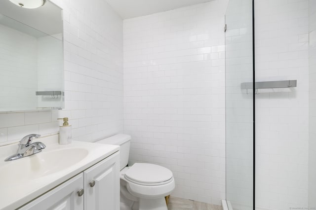 full bath with tasteful backsplash, toilet, vanity, tiled shower, and tile walls