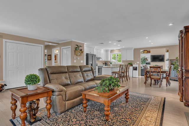 living room featuring recessed lighting and light wood finished floors