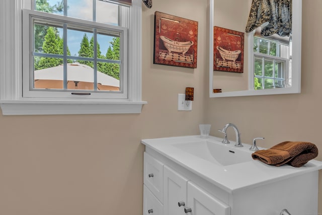 bathroom featuring vanity and a wealth of natural light