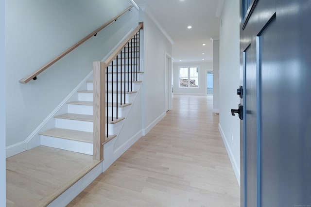 entrance foyer featuring stairway, light wood-style flooring, baseboards, and recessed lighting