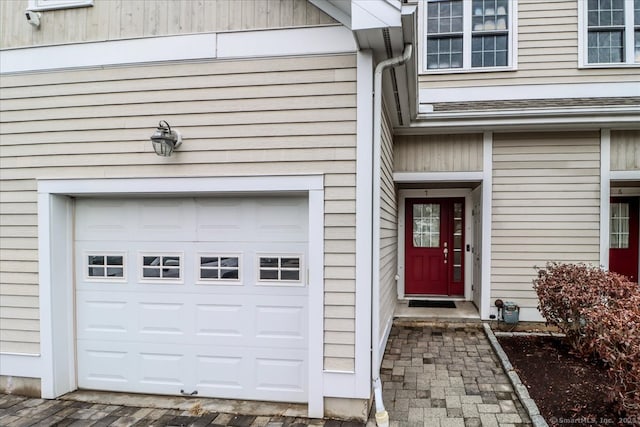 doorway to property featuring a garage