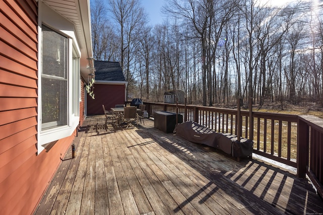 wooden terrace featuring outdoor dining space