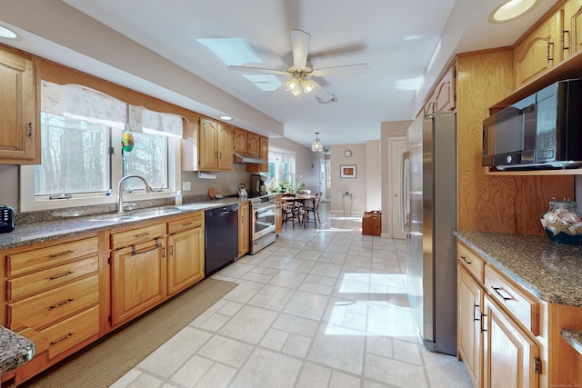 kitchen featuring a ceiling fan, a sink, under cabinet range hood, and black appliances