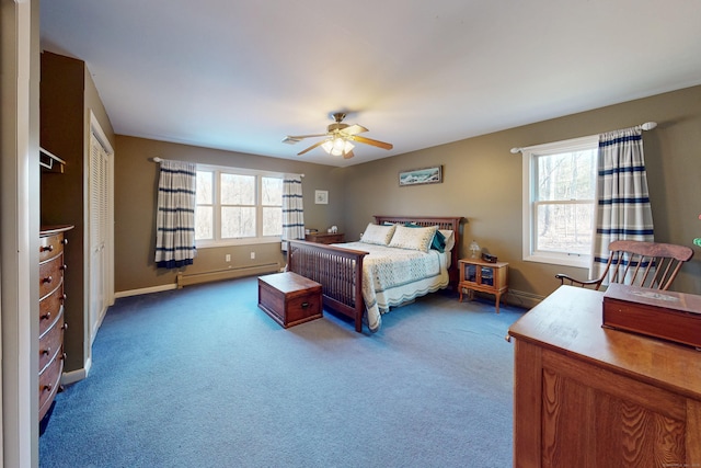 carpeted bedroom with baseboards, ceiling fan, and baseboard heating