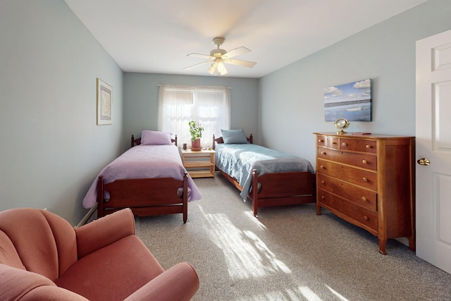 bedroom with a ceiling fan and carpet flooring