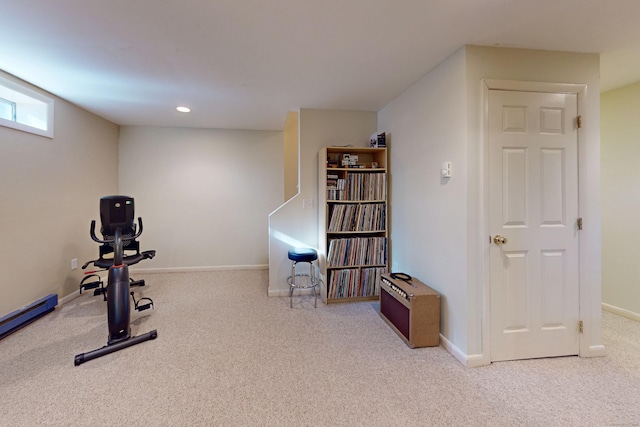 workout area featuring recessed lighting, carpet, and baseboards