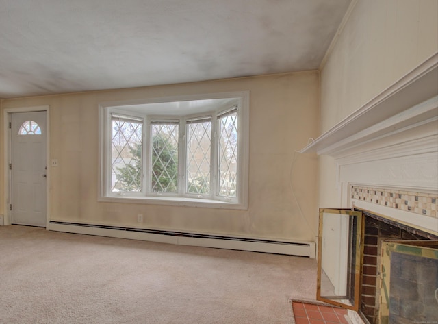 unfurnished living room with ornamental molding, a baseboard radiator, carpet flooring, and a fireplace