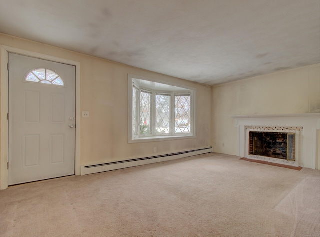 unfurnished living room with a baseboard radiator, a fireplace, and carpet