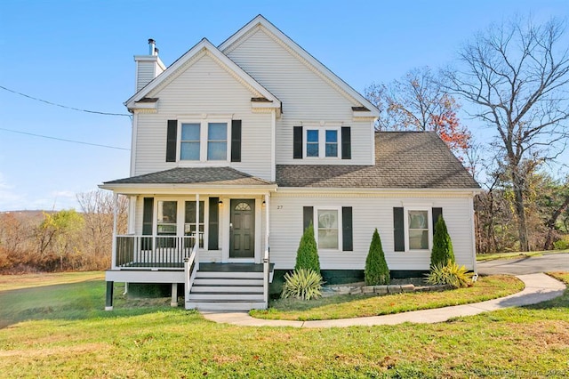 view of front facade with a porch, a shingled roof, a chimney, and a front lawn