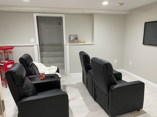 home theater room with baseboards and recessed lighting