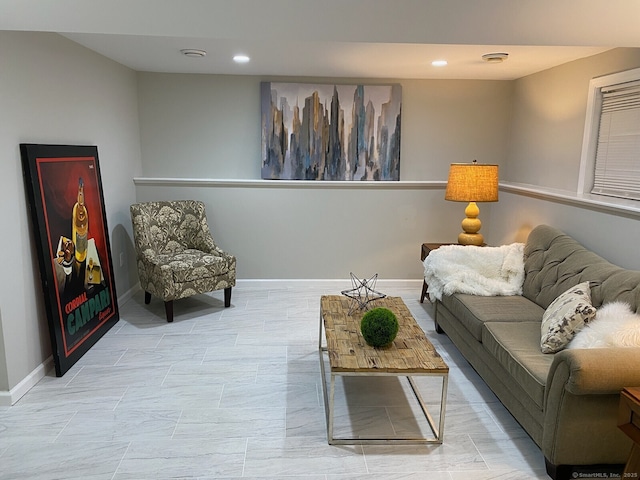 living room featuring recessed lighting and baseboards