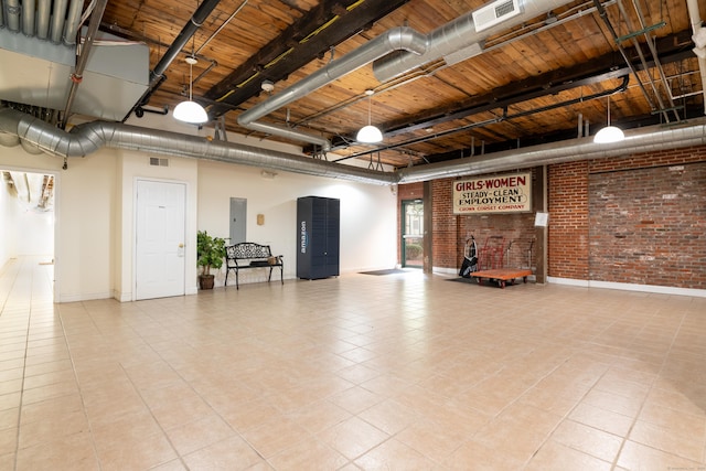 390 Charles St Apt 216, Bridgeport, CT 06606 - garage with baseboards, wooden ceiling, visible vents, and electric panel