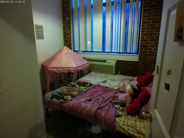 390 Charles St Apt 216, Bridgeport, CT 06606 - bedroom with an AC wall unit and brick wall