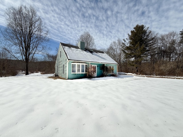 view of front of home featuring a chimney