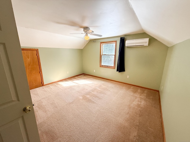 additional living space featuring light colored carpet, a wall mounted AC, baseboards, and lofted ceiling