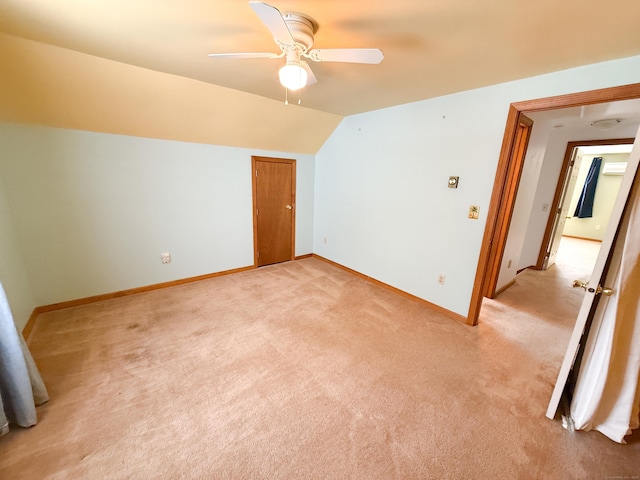 bonus room featuring light carpet, ceiling fan, baseboards, and vaulted ceiling