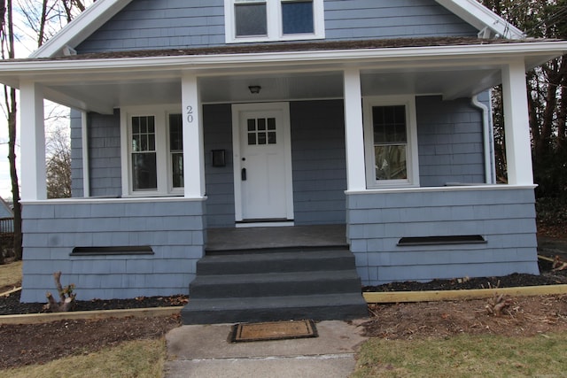 doorway to property featuring a porch