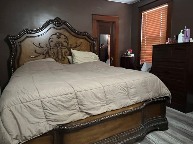 bedroom featuring wood finished floors