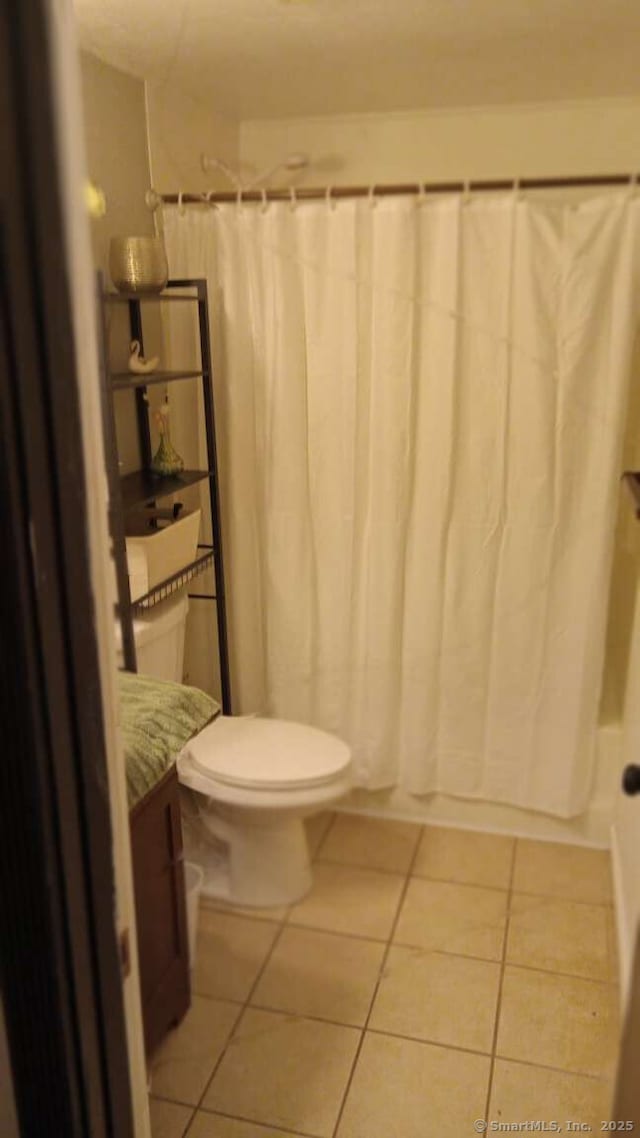 bathroom with vanity, toilet, and tile patterned floors