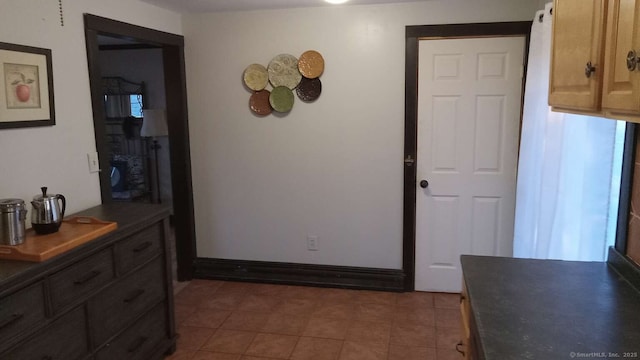 interior space featuring baseboards