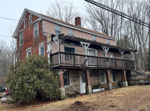 exterior space featuring a chimney