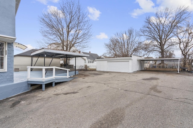 exterior space featuring a garage and fence