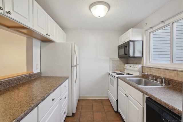 kitchen featuring tasteful backsplash, white cabinetry, black appliances, and a sink