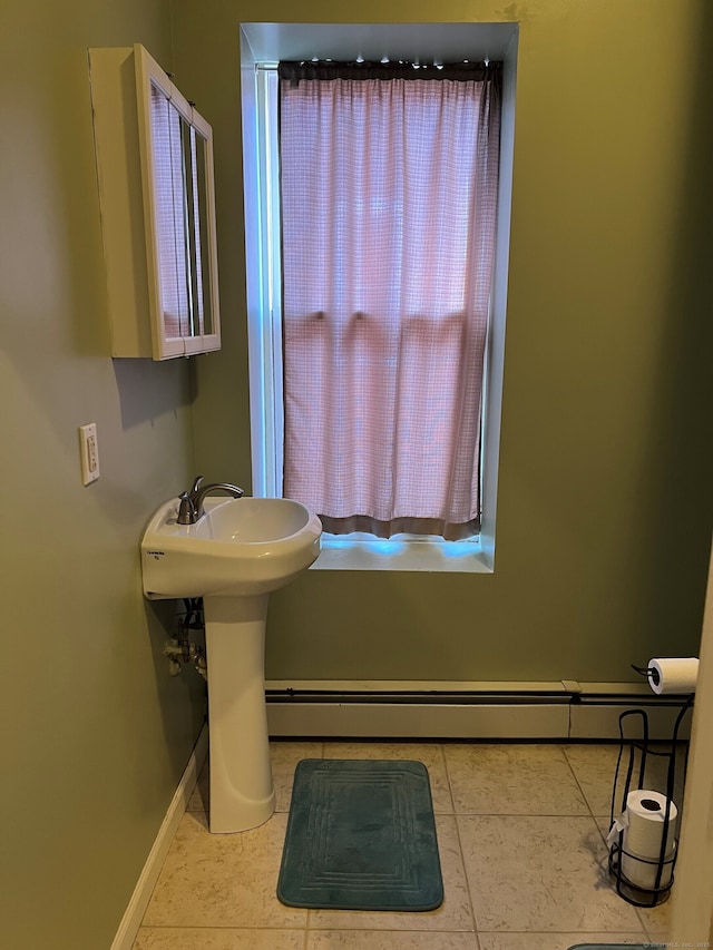 bathroom featuring baseboards and tile patterned floors