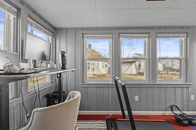 workout area with wood finished floors and baseboards