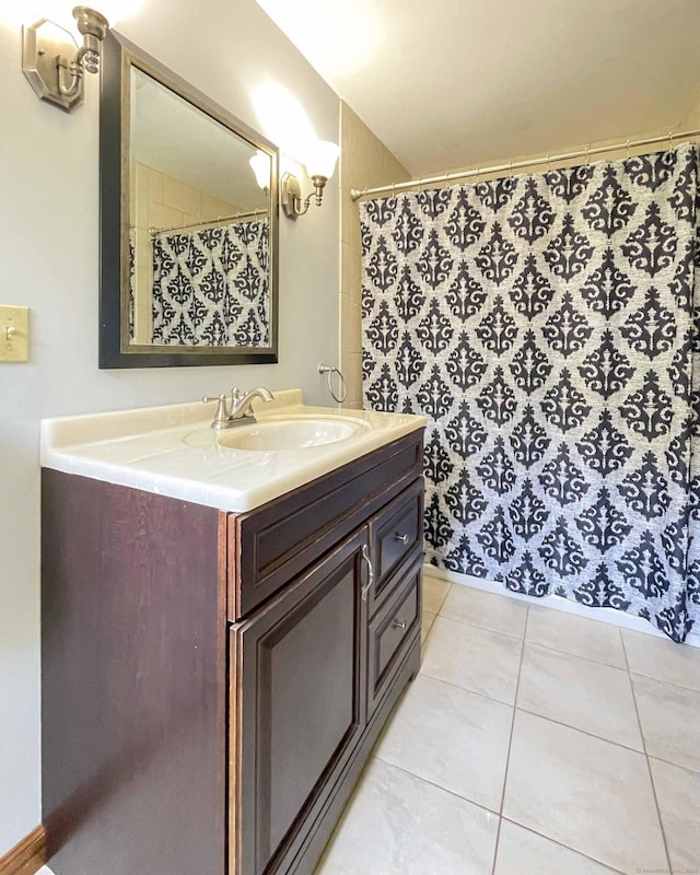 bathroom with vanity and tile patterned flooring