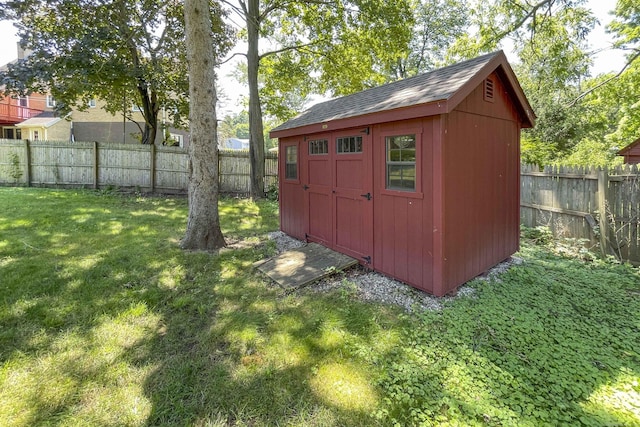 view of shed with a fenced backyard